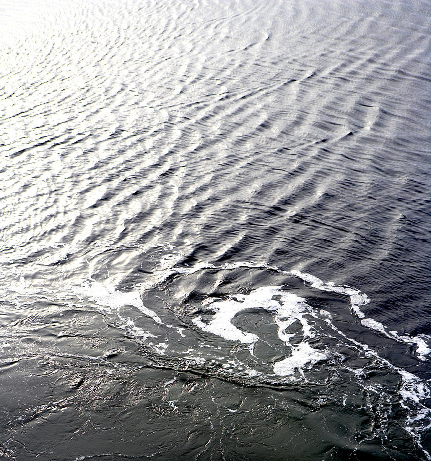 Wake in sea Photograph by Thomas Northcut
