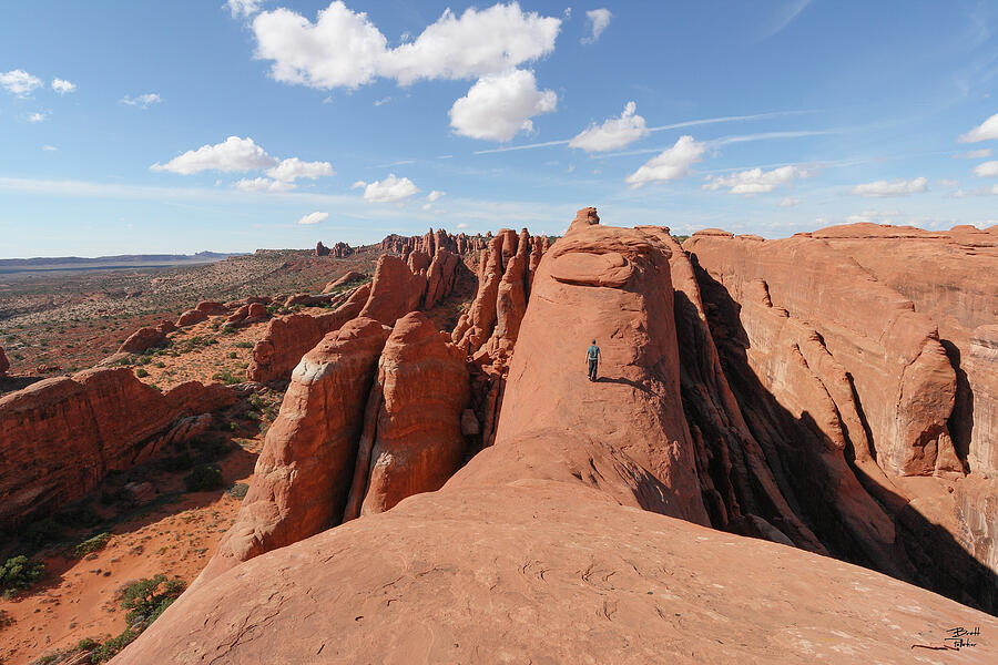 Walking the fins of the Fiery Furnace - Arches National Park, Utah Photograph by Brett Pelletier