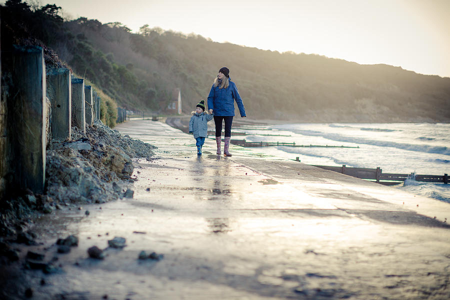 Walking with mum at Totland bay Photograph by s0ulsurfing - Jason Swain