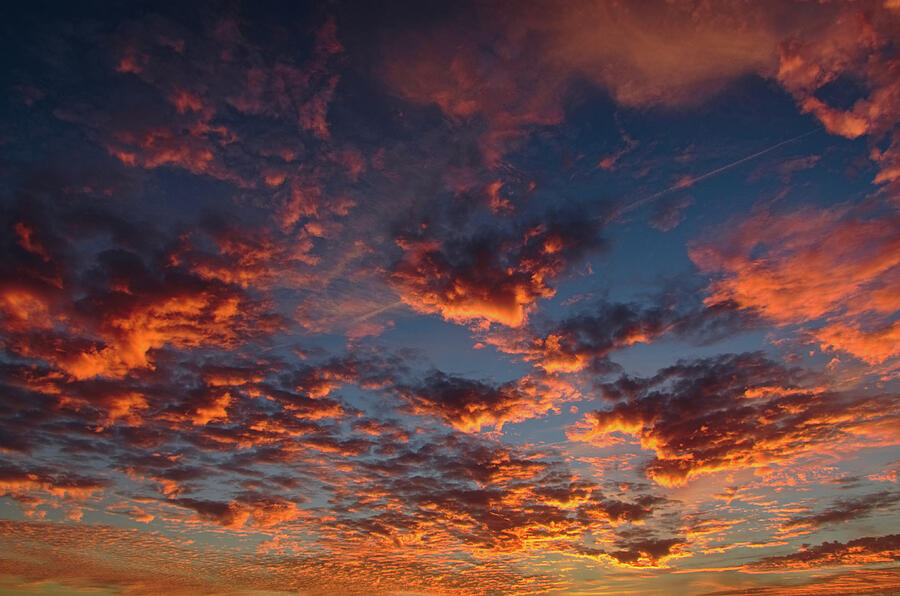 Warm and vibrant cloudscape at sunset In Albufeira Photograph by Angelo DeVal