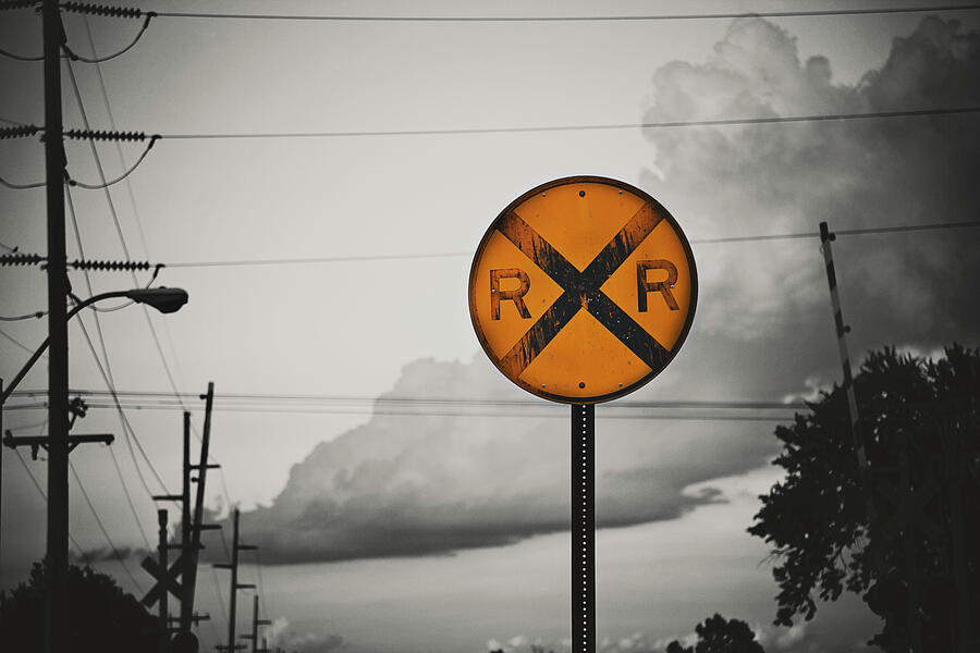 Warning - Storm and Railroad Crossing Ahead Photograph by Toni Hopper