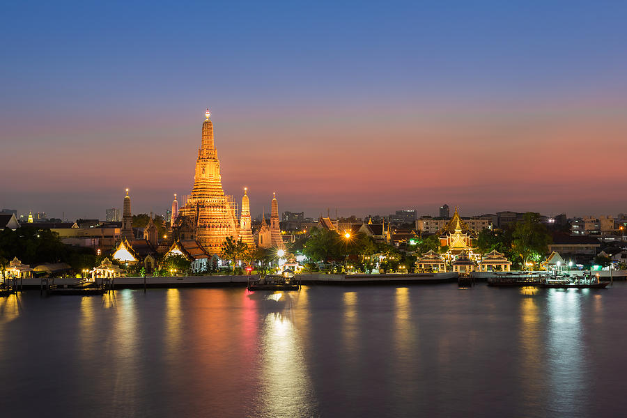 Wat Arun - the Temple of Dawn water front Photograph by Pranodhm