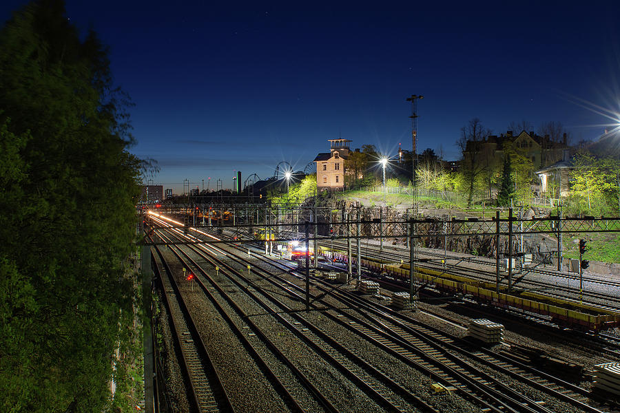 Night Photograph - Watching over the railtracks by Marko Hannula Night Photograph - Watching over the railtracks by Marko Hannula