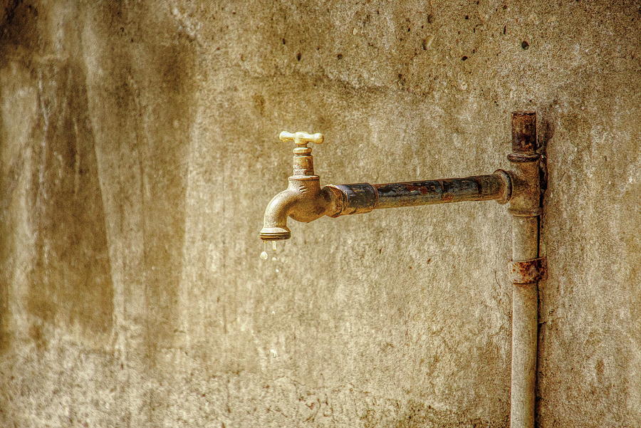 Water Dripping From an Old Rusty Spigot Photograph by Darryl Brooks