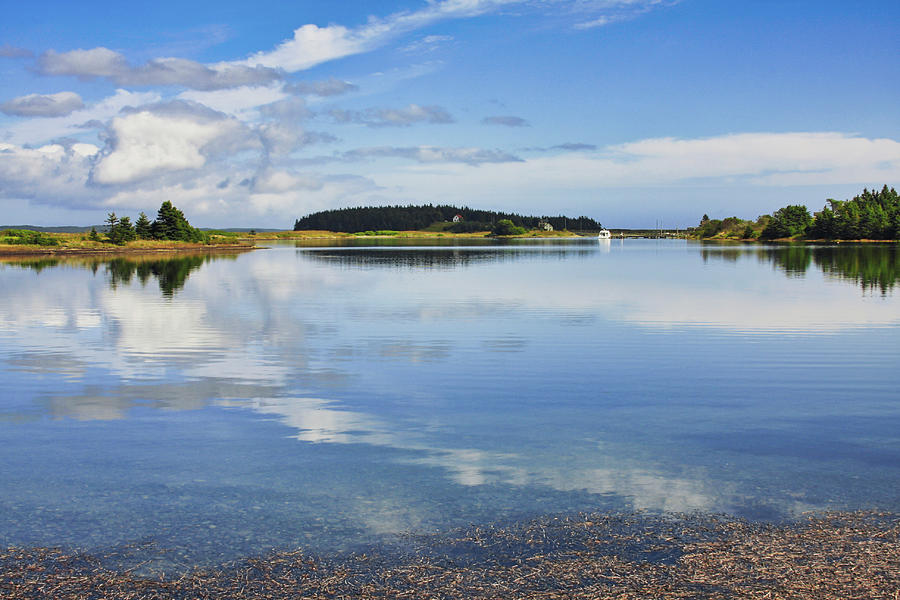 Water, sky and land reflections Gabarus, Nova Scotia Photograph by Tatiana Travelways