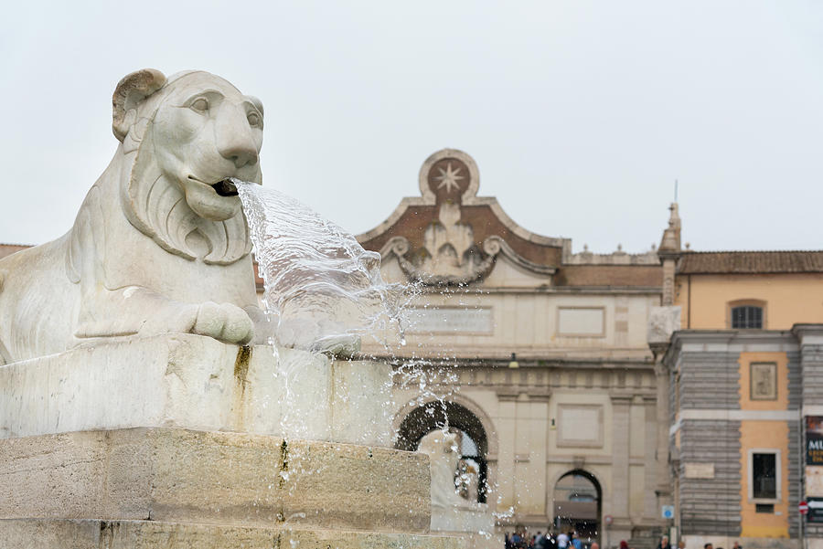 Water through the lion statue head at the Piazza del Popolo , Rome Italy. Photograph by Michalakis Ppalis