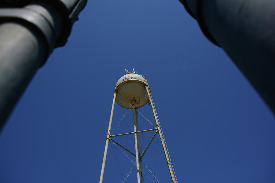 Water Tower in the blue sky Photograph by Brigitta Diaz - Fine Art America