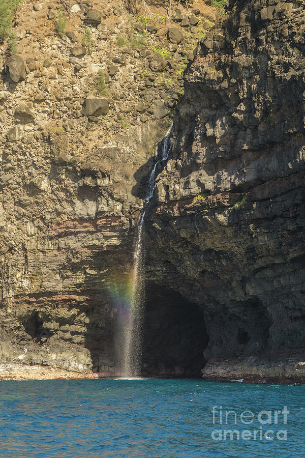 Waterfall at Honololo Sea Cave on the NaPali Coast of Hawaii Photograph by Nancy Gleason