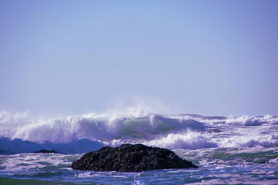 Wave Coming Towards A Rock Photograph