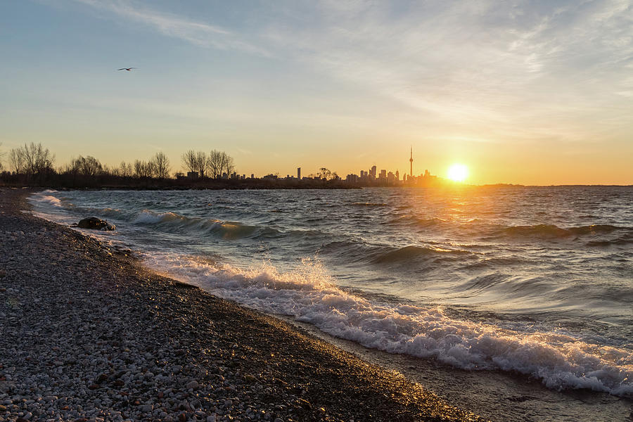 Wave Splash Sunrise - Toronto Skyline Behind Rough Lake Ontario Photograph by Georgia Mizuleva