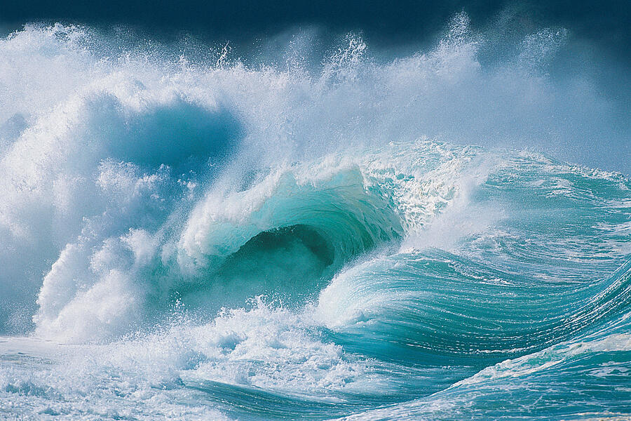 Waves crashing Photograph by Digital Vision.