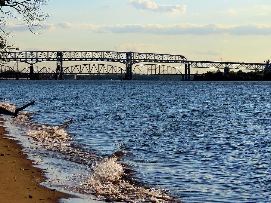 Waves Lapping the Shore of the Delaware River Near Betsy Ross and Delair Memorial Railroad Bridges Photograph by Linda Stern