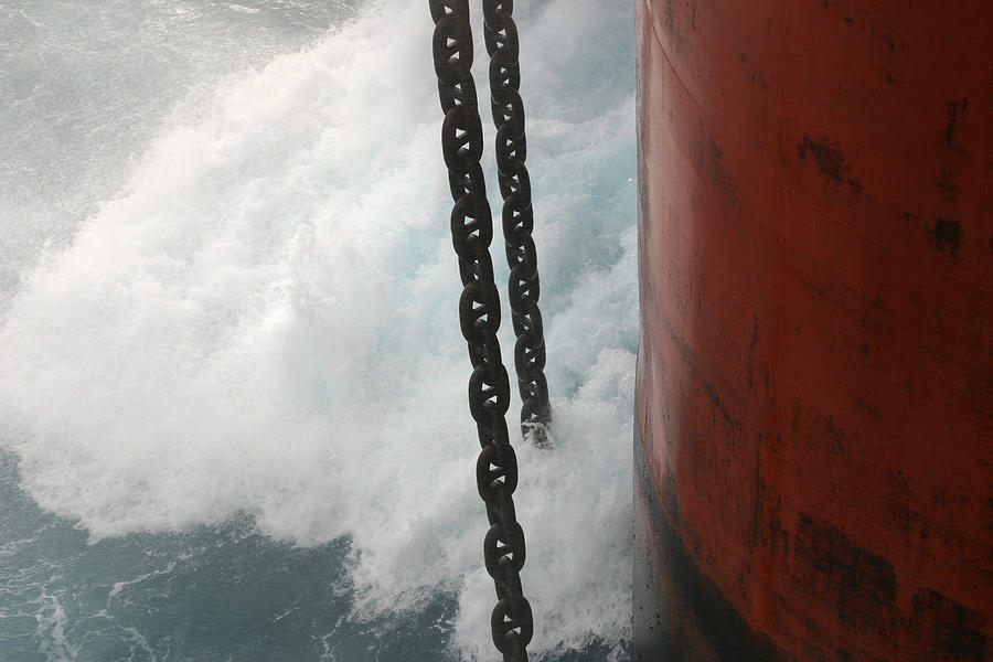 Waves On Oil Rig Leg Photograph by Mikeuk
