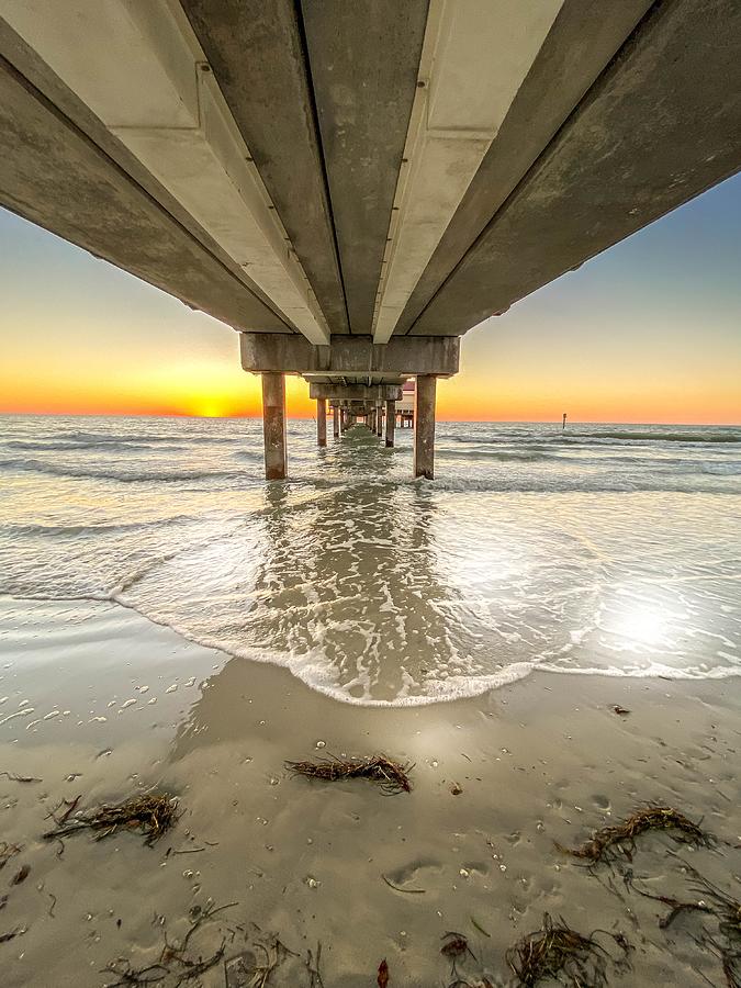 Waves under Clearwater Beach Pier Photograph by Susan Rydberg