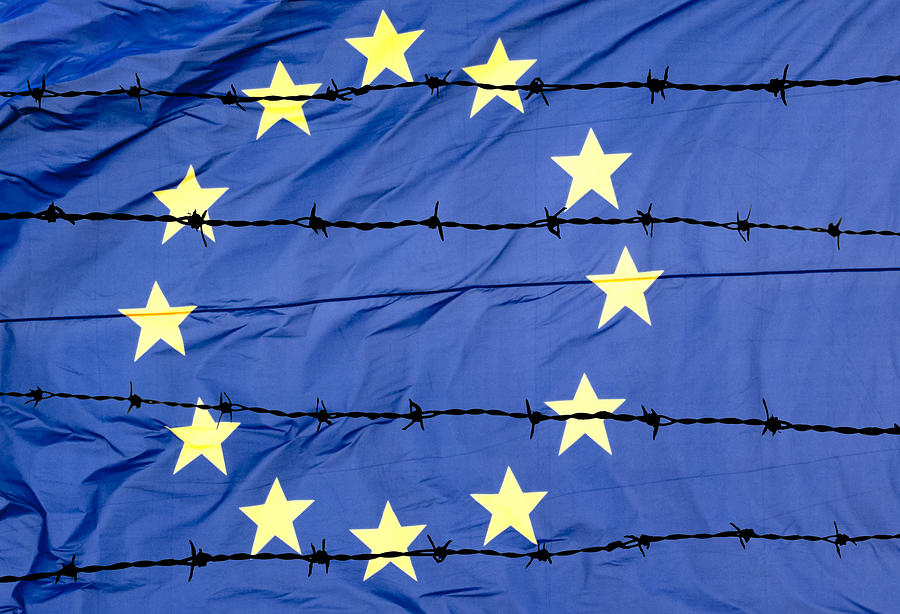 Waving European Union flag and barbed wire. Photograph by Jose A. Bernat Bacete