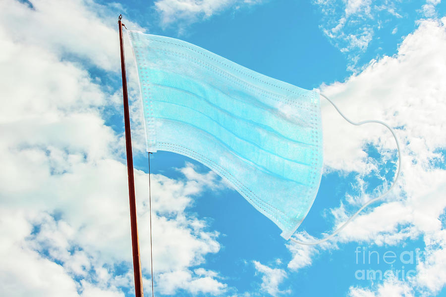 Waving flag of a surgical mask Photograph by Benny Marty