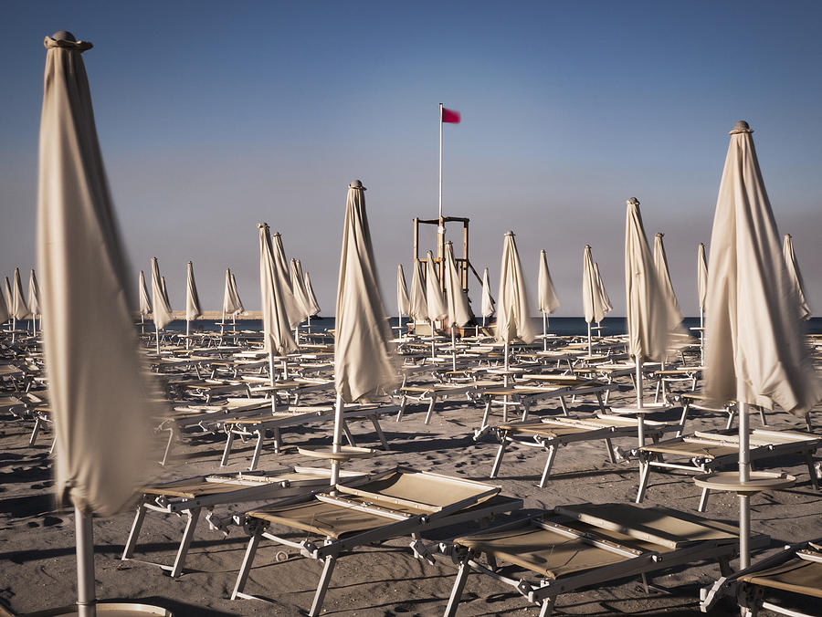 Waving Umbrellas On The Beach Photograph by Bernd Schunack