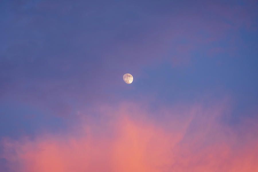Waxing Gibbous Moon Between Sunset Clouds Photograph by Alexios Ntounas