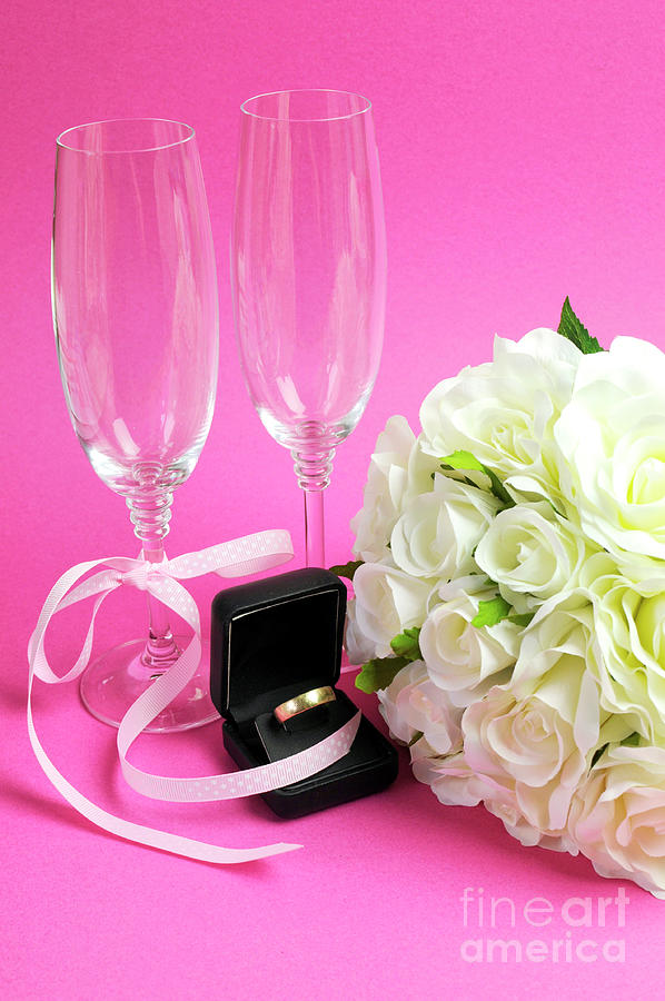 wedding bridal bouquet of white roses on pink background with pair of champagne flute glasses and wold weggind ring in black jewellery box vertical photograph by milleflore images wedding bridal bouquet of white roses on pink background with pair of champagne flute glasses and wold weggind ring in black jewellery box vertical