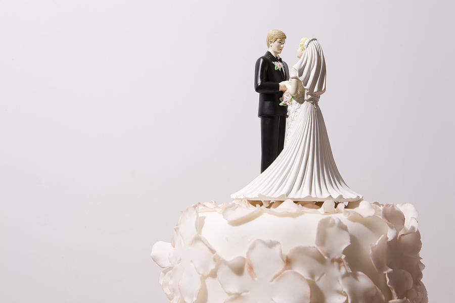 Wedding cake and bride and groom cake topper Photograph by Cclickclick