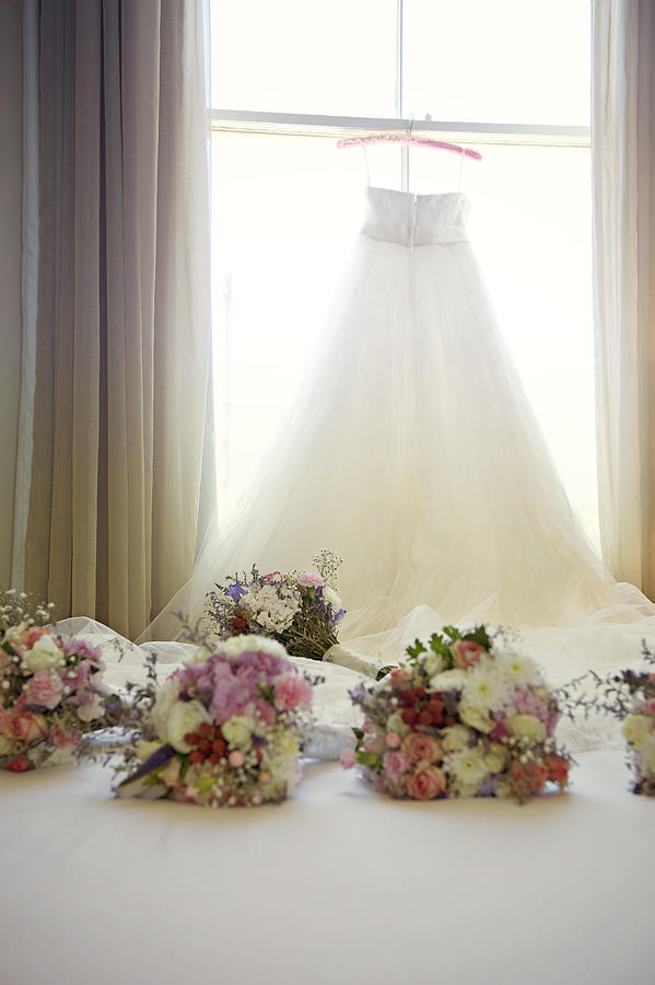 Wedding gown and bouquets Photograph by Sharon Lapkin