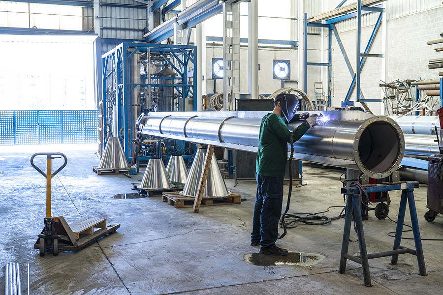 Welder welding stainless steel big pipe Photograph by Mediterranean