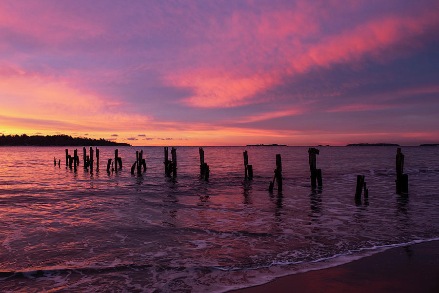 West Beach Red Sunrise over the Pilings Beverly Massachusetts Photograph by Toby McGuire