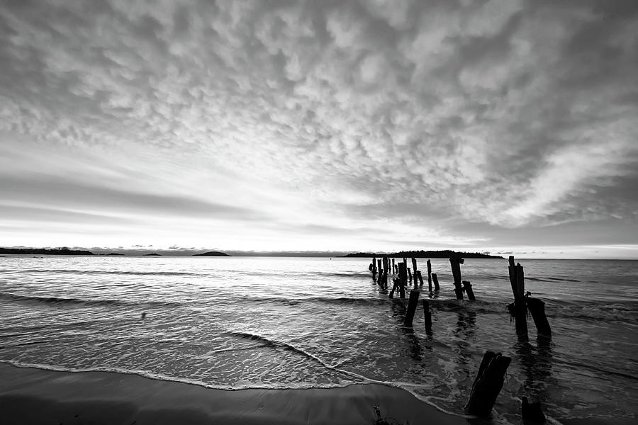 West Beach Sunrise over the Pilings Beverly Massachusetts Red Sunset Black and White Photograph by Toby McGuire