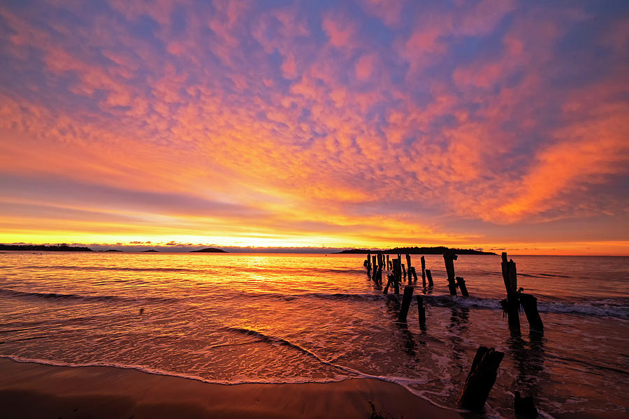West Beach Sunrise over the Pilings Beverly Massachusetts Red Sunset Photograph by Toby McGuire