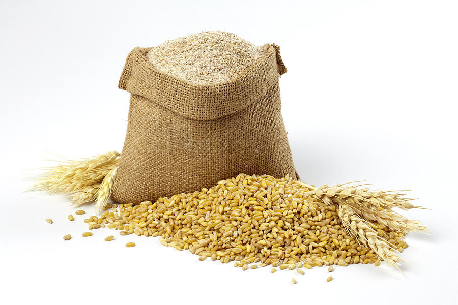Wheat grain and bran sack Photograph by Aleaimage