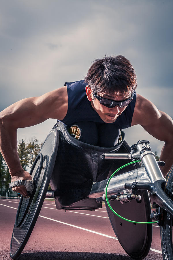 Wheelchair athlete racing Photograph by Trevor Williams