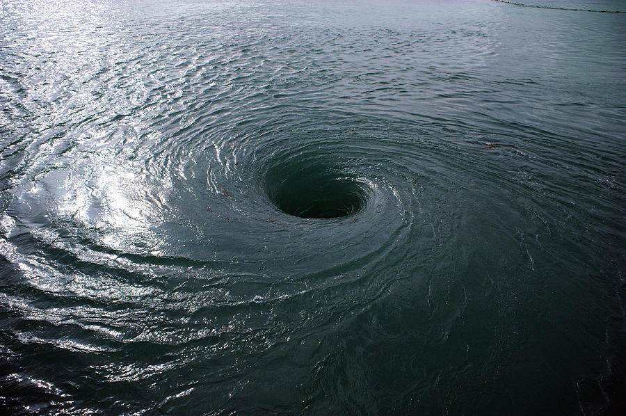 Whirlpool vortex in water Photograph by Jupiterimages