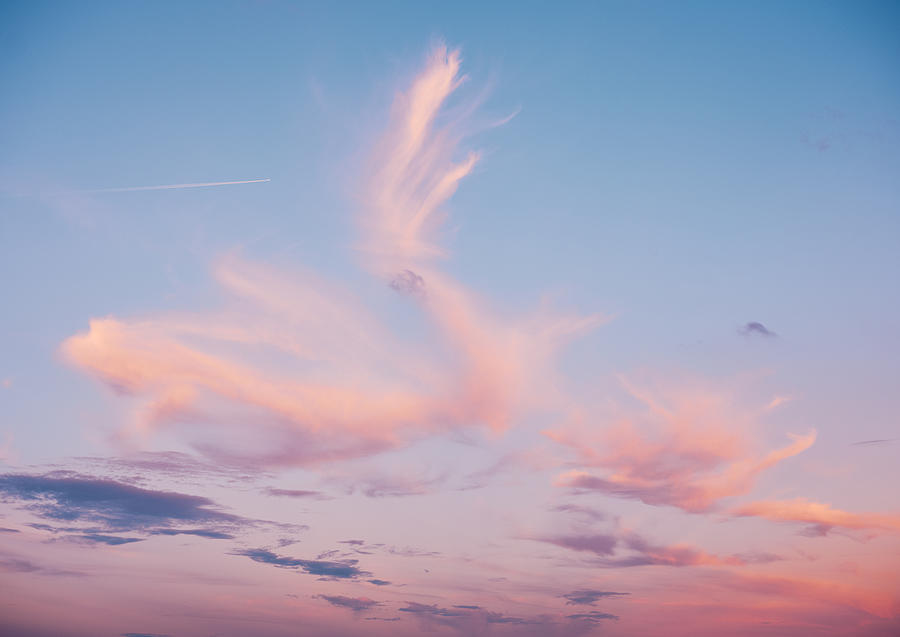 Whispy clouds at sunset Photograph by Gary Yeowell