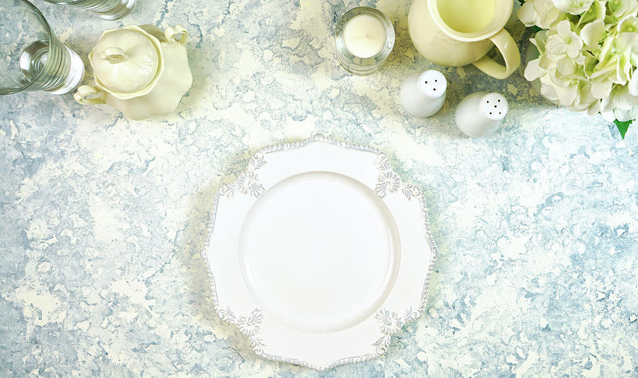 White aesthetic fine china events table place settings top view flat lay. Photograph by Milleflore Images