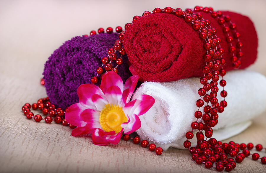 White and red towel around beads and flowers Photograph by Ka2shka