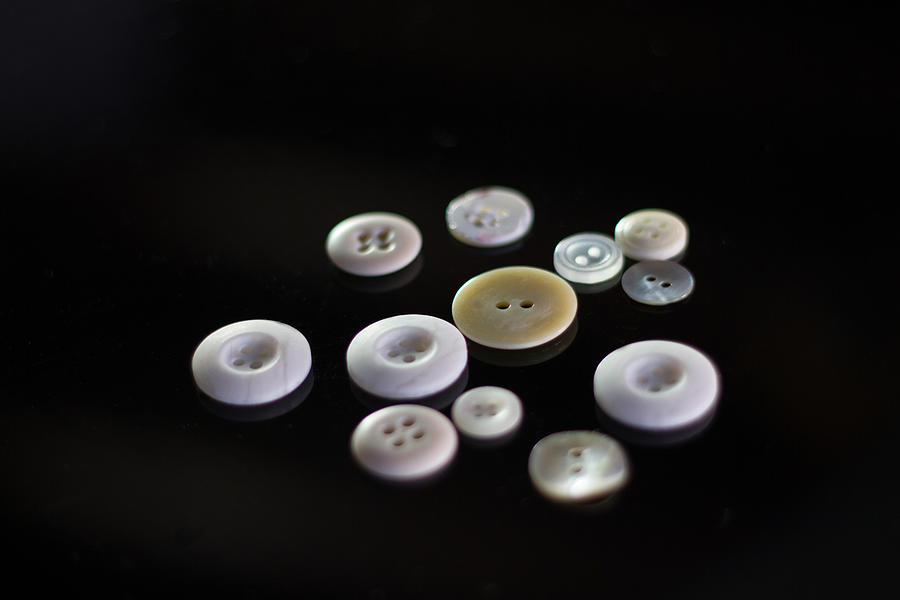 White Buttons on Black Background Photograph by JannHuizenga
