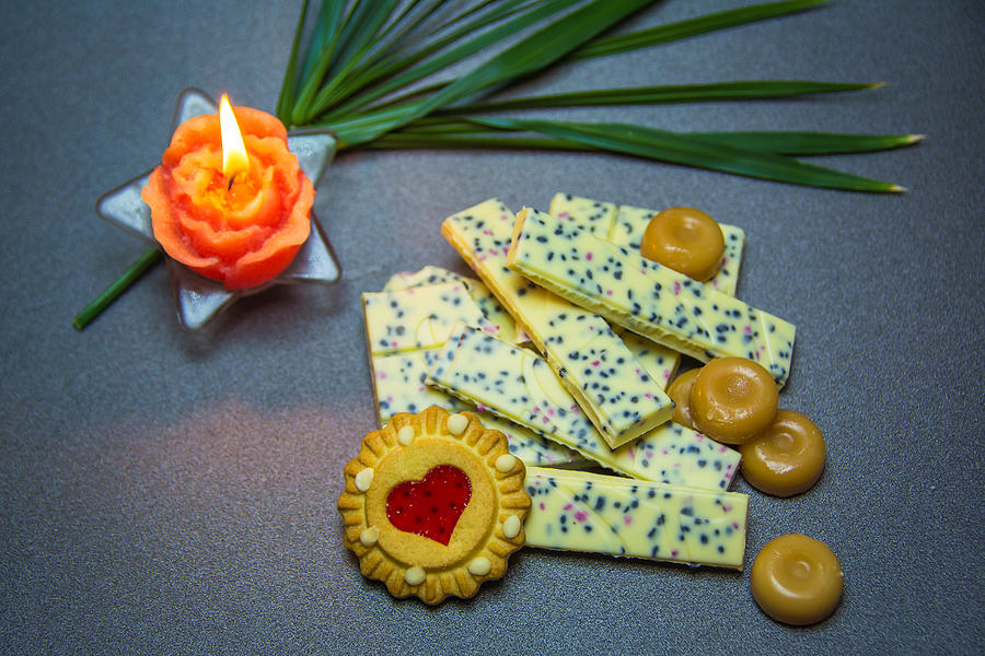 White Chocolate Cookies Candle On A Dark Background. Photograph by Alfaphotorus