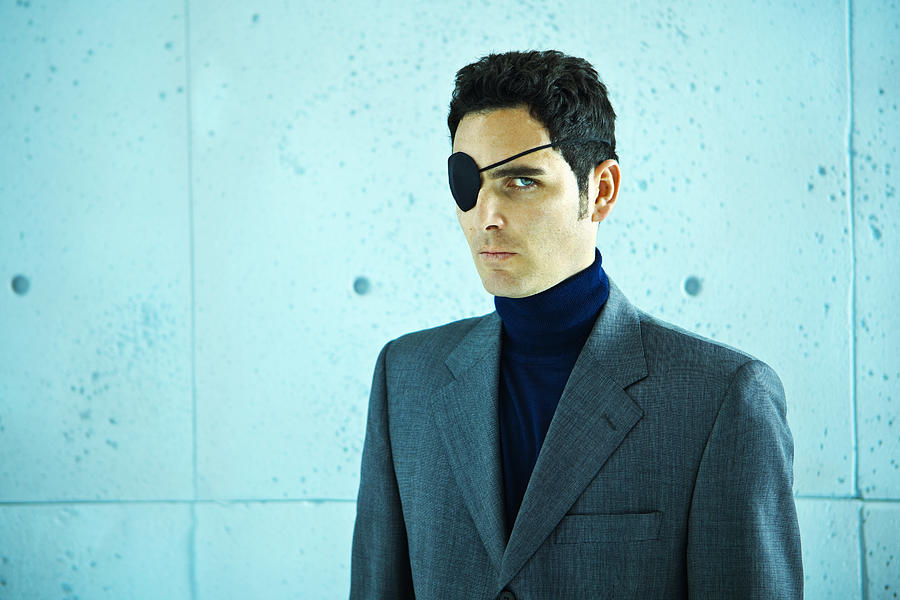 White collar crime: businessman with eye patch Photograph by Caracterdesign
