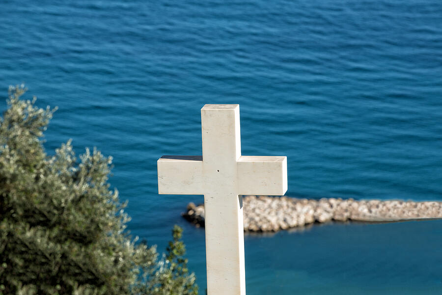 White cross in cemetery above the sea Photograph by Jean-Marc PAYET