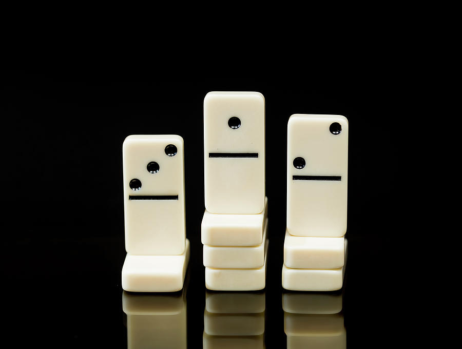 White dominoes showing winner of race Photograph by Steven Heap