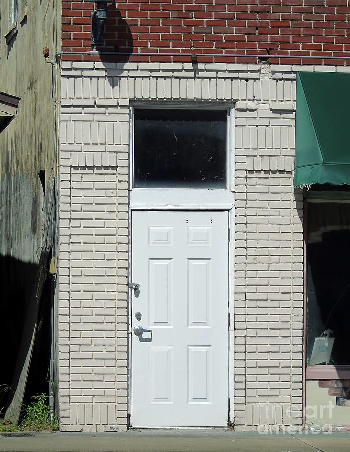 White Door On The Old Brick Building Photograph by D Hackett