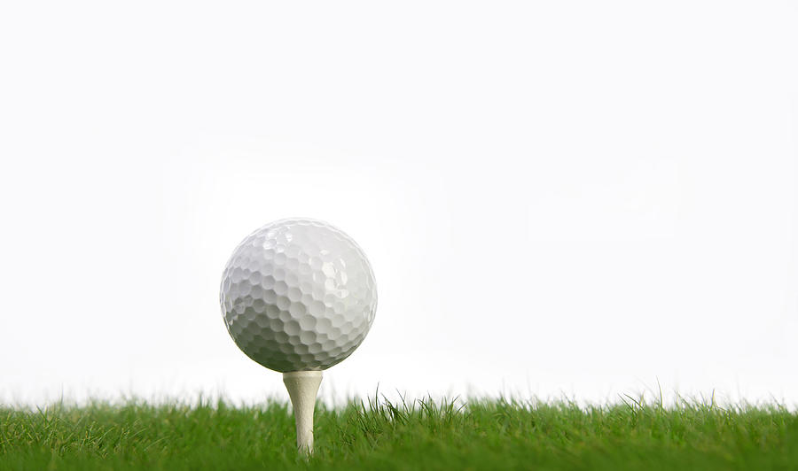 White Golf Ball and tee on green grass Photograph by HadelProductions