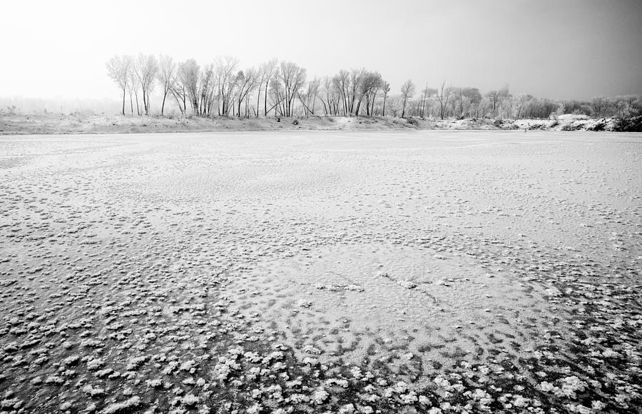 White Landscapes - Frozen lake with ice patterns in winter. Photograph by Robb Reece