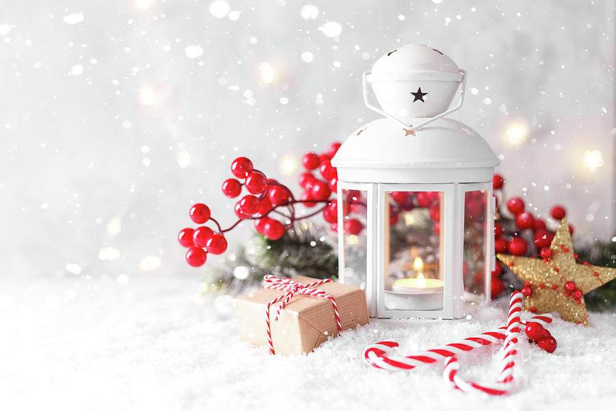 Christmas Photograph - White lantern and red decorations on snow by Lana Malamatidi