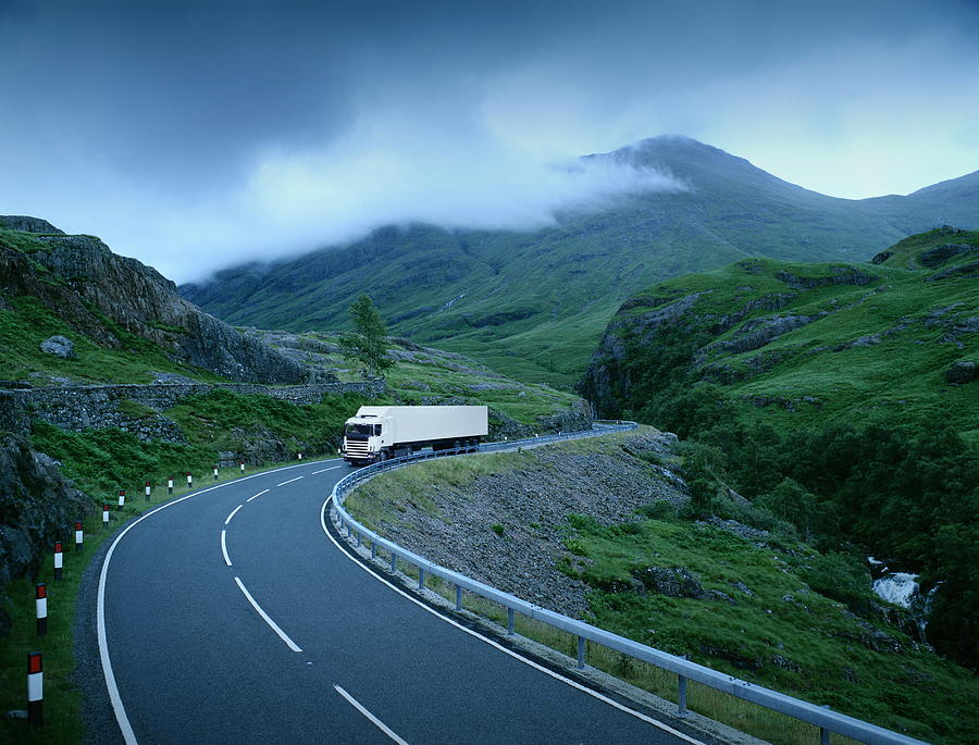 White lorry on road through rural landscape (Digital Composite) Photograph by Alan Thornton