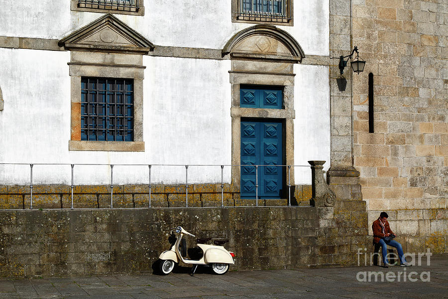White motor scooter outside the Treasury Museum Porto Portugal Photograph by James Brunker