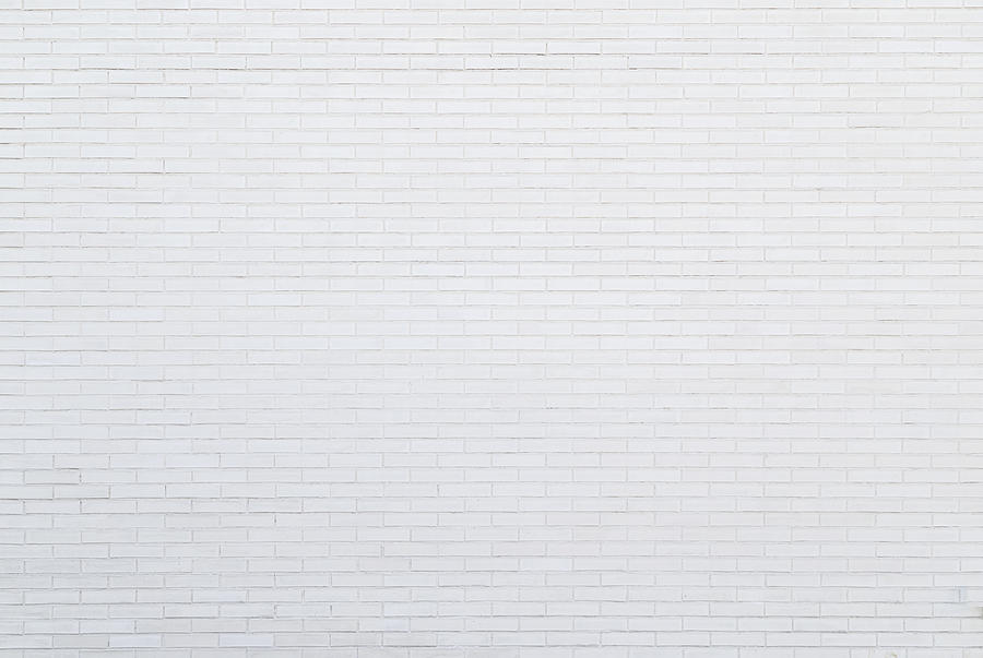 White new brick wall viewed from the front. Photograph by Tuomas Lehtinen
