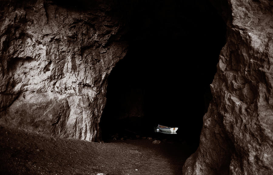 White Rowboat in a Dark Grotto Photograph by Wayne King