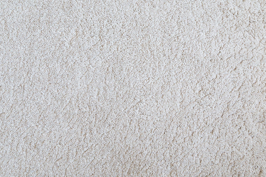 White shaggy carpet texture background viewed from above. Photograph by Tuomas Lehtinen