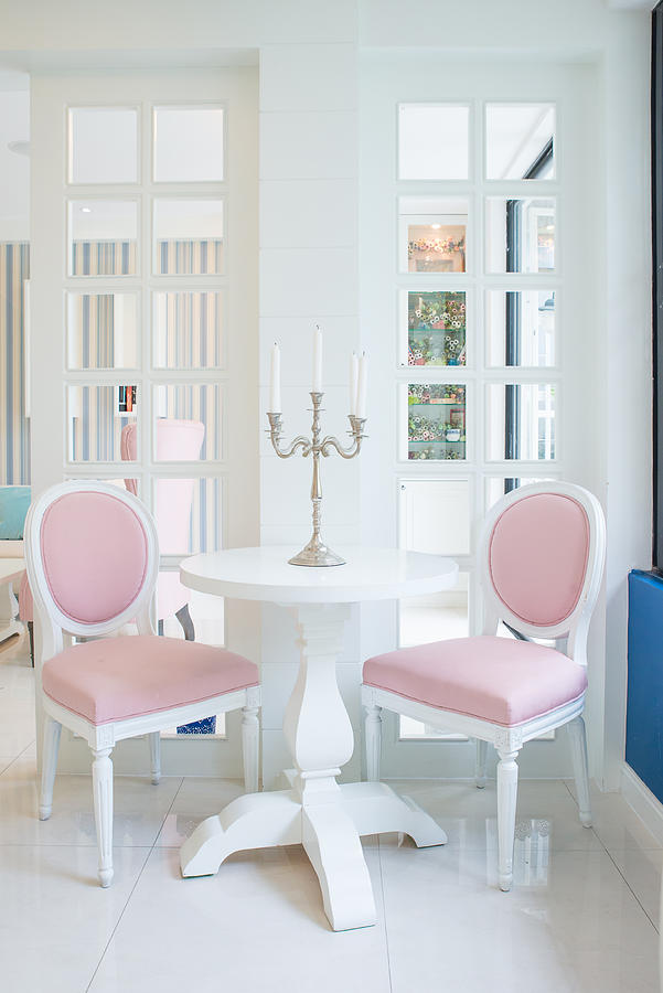 White table and pink chair with candle in living room Photograph by Ake1150sb
